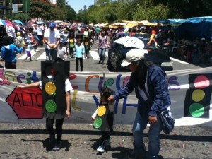 Carina, Teresa, and Tia Celia leading the way in the train of little stop-lights