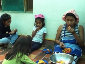 Alayna, Valeria, and Elena, enjoying their "refrigerio" (snack)